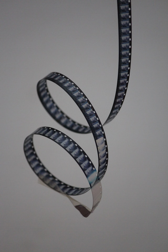A monochrome still of a reel of film. It spirals twice.