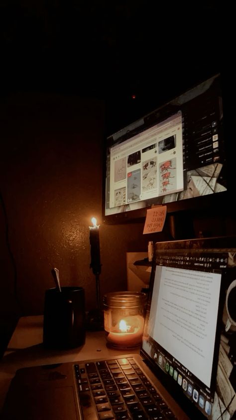 a computer set up with a laptop displaying writing on a google doc