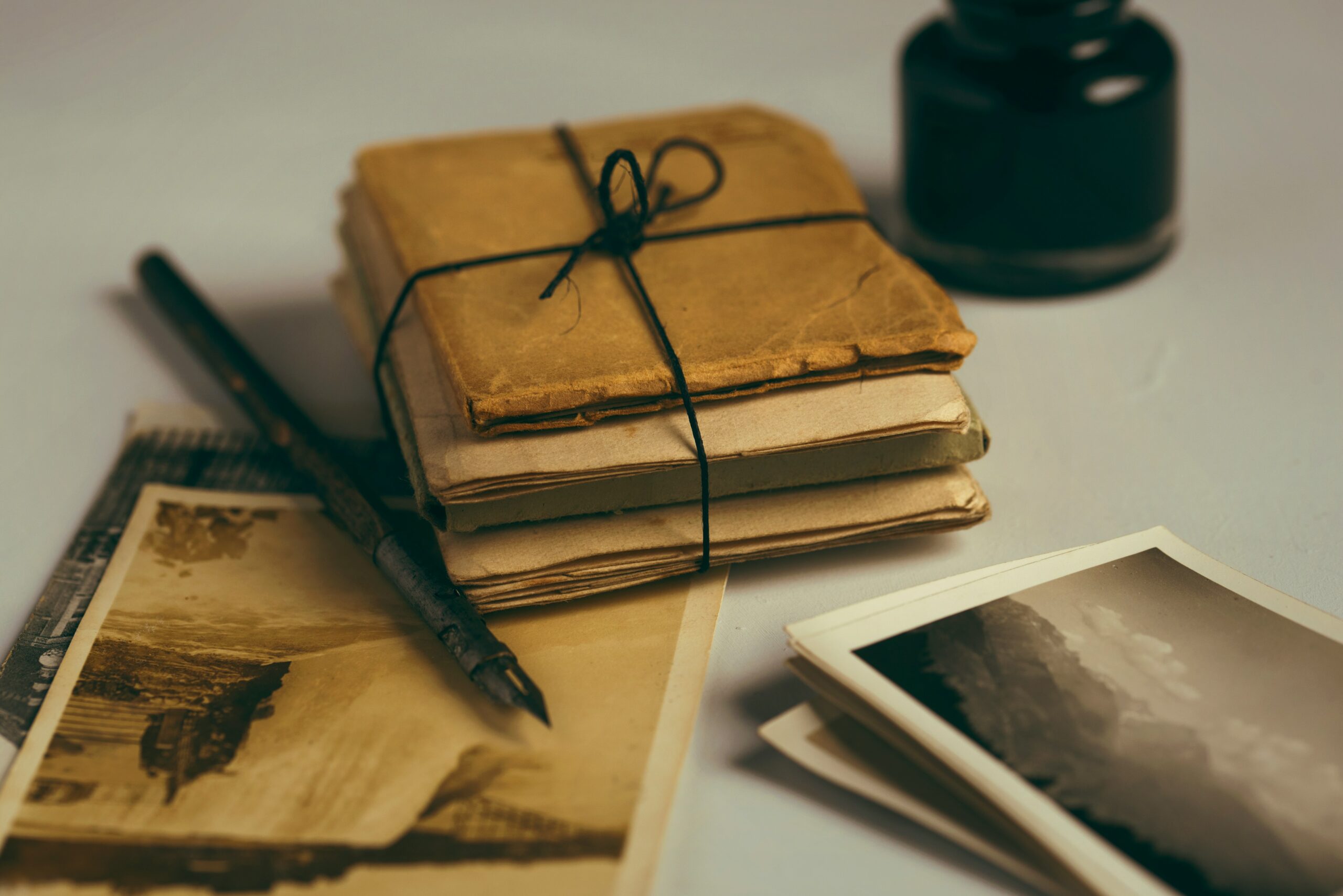 A stack of handwritten letters tied together.