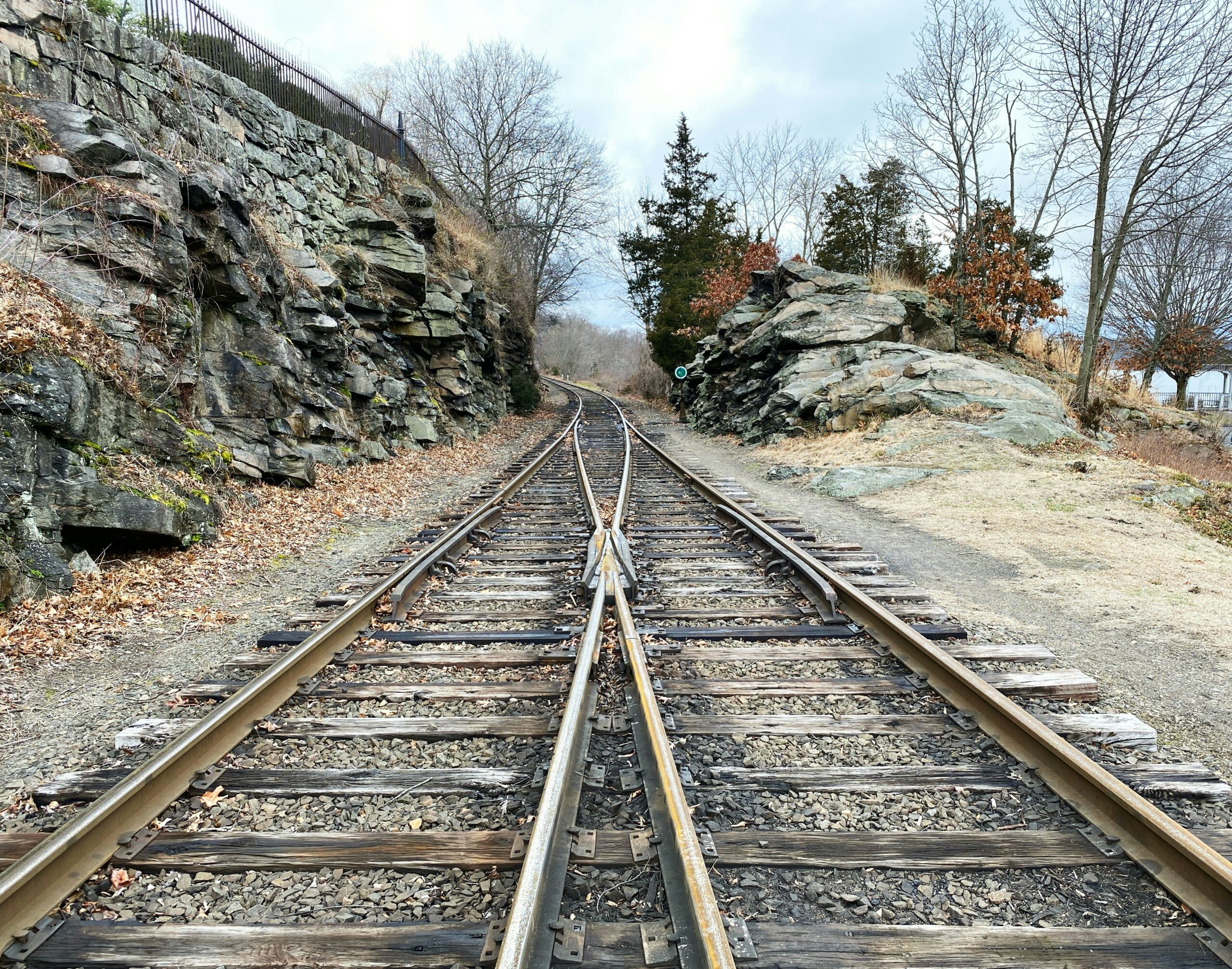 Two train tracks merging into one.