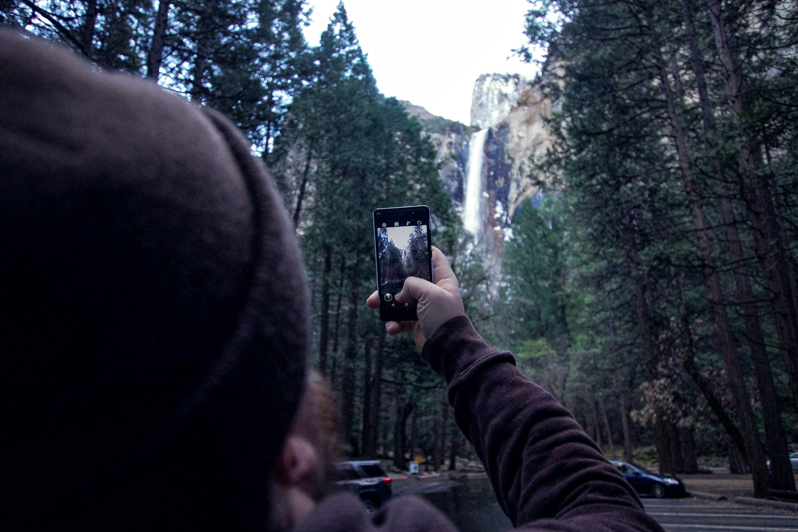 man taking a picture on his phone
