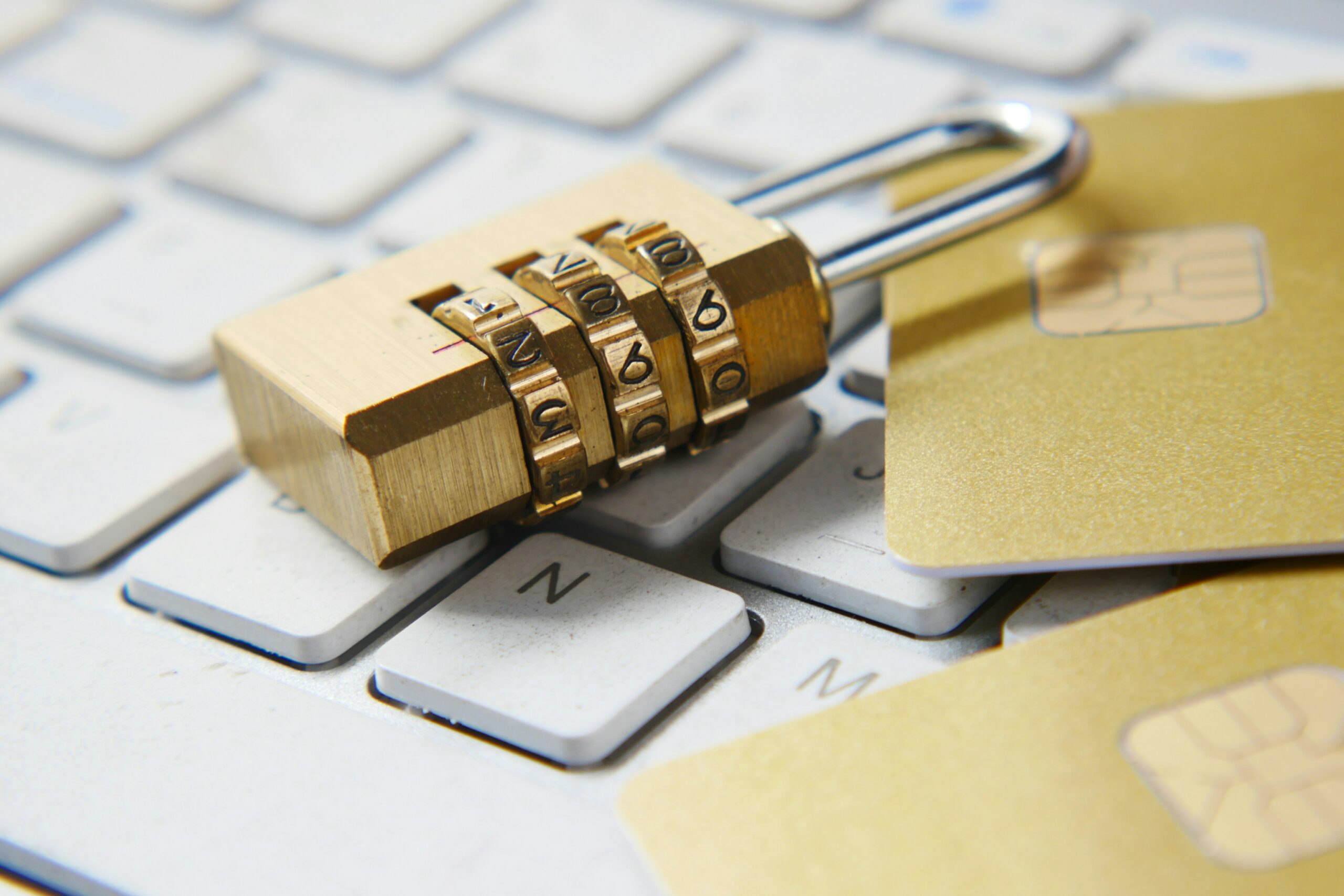 Photo of a gold lock on a keyboard