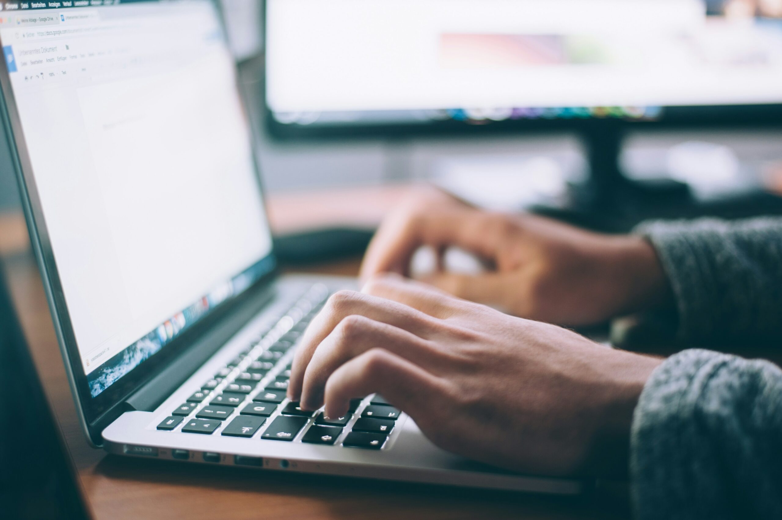 Hands typing on Keyboard