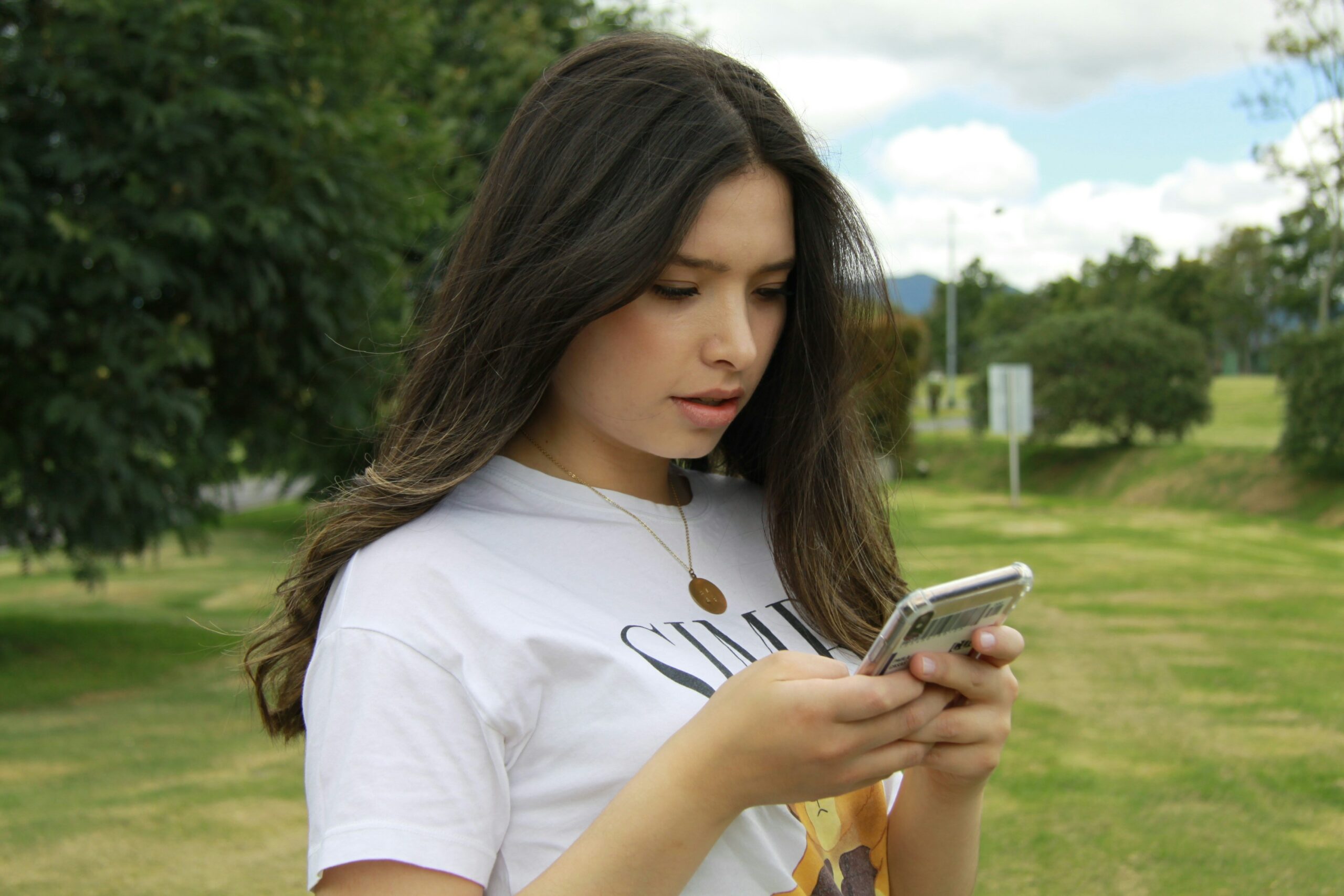 A girl texting on her I phone