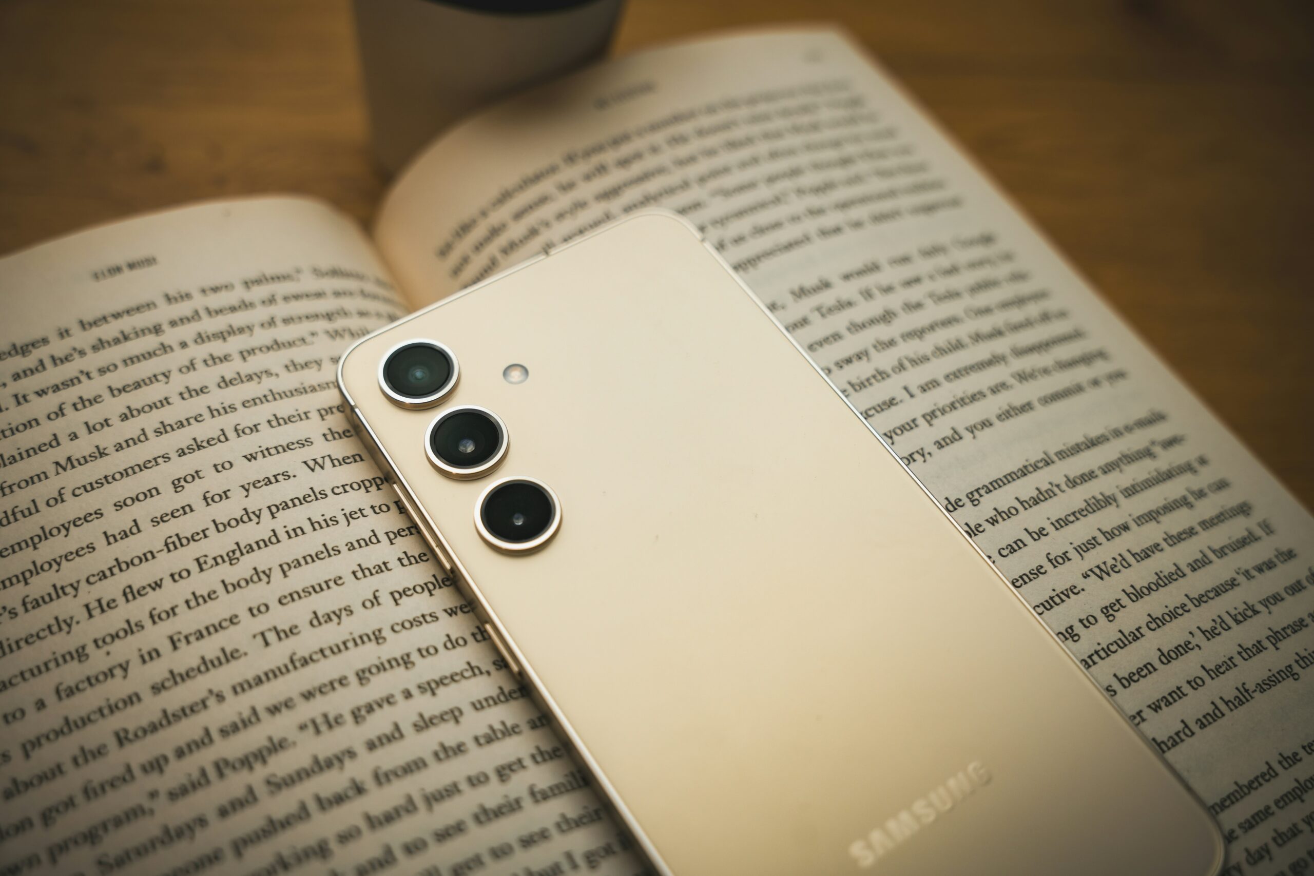 Cellphone sitting on an open book