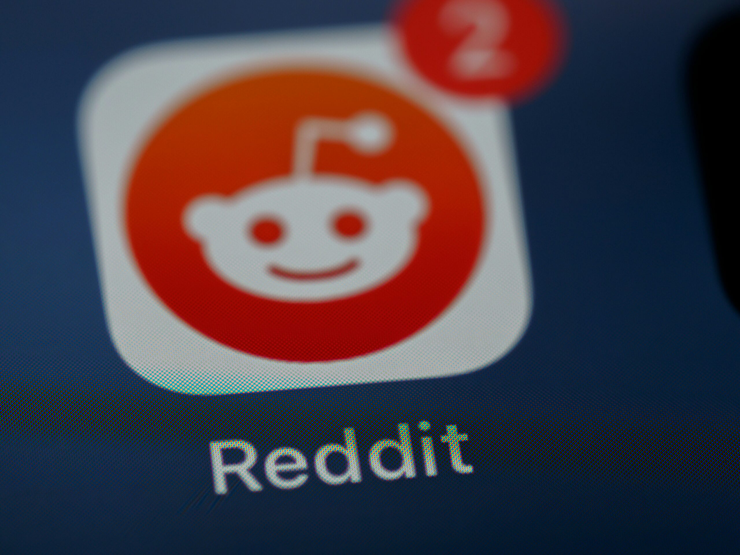 The image displays an icon of the Reddit app, showing that there are two notifications from the app.